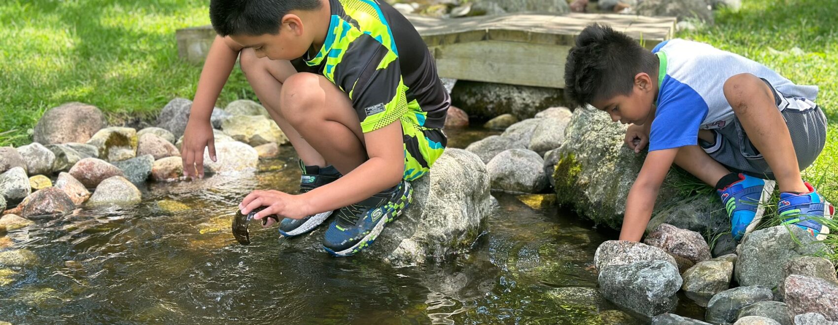 Children exploring the water at Woodland Dunes