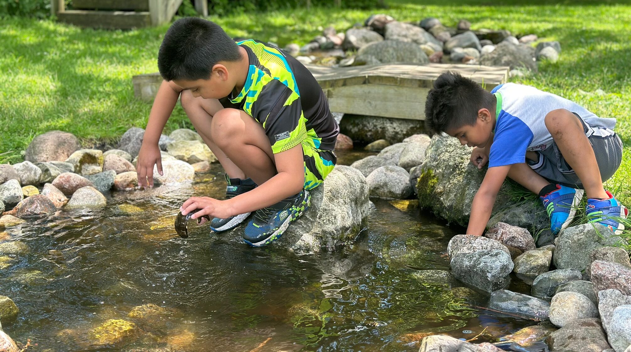 Children exploring the water at Woodland Dunes