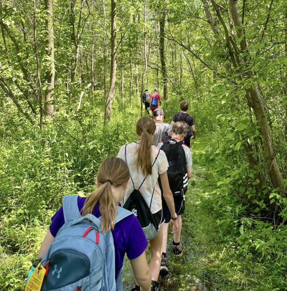 Teens hiking on a trail