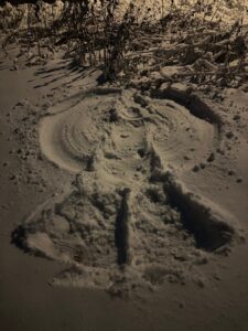 photo of manmade snow angel in the snow